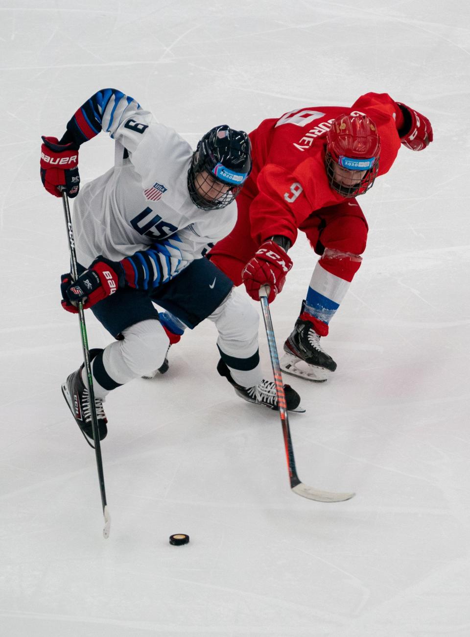 Jan 21, 2020; Lausanne, SWITZERLAND;   
Team USA's Cutter Gauthier carries the puck against Russia's Danil Grigoriev during the Winter Youth Olympic Games on Jan. 21, 2020, in Lausanne, Switzerland.