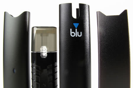 An electronic cigarette device made by JUUL (R) is shown next to other similar devices (L to R) Vuse Alto, Suorin ishare and myblu in this photo illustration taken September 20, 2018. REUTERS/Mike Blake/Illustration