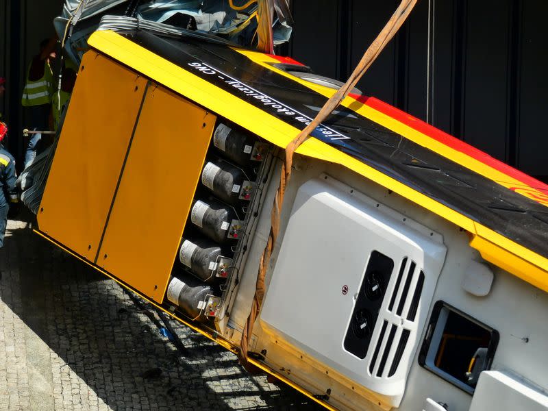 First responders attend to the scene of a public bus crash in Warsaw