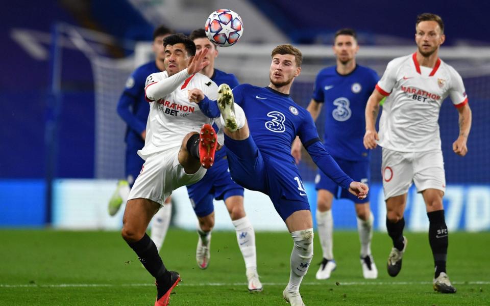 Chelsea's German striker Timo Werner (R) and Sevilla's Argentine midfielder Marcos Acuna (L) go for the ball during the UEFA Champions League first round Group E football match between Chelsea and Sevilla at Stamford Bridge - Chelsea earn clean sheet in improved defensive display to draw with Sevilla - GETTY IMAGES