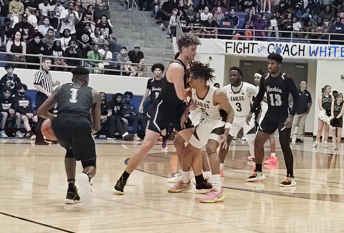 Waxahachie guard King Grace (1) gets a screen from Parker Jefferson (center) on Mansfield Lake Ridge forward Ahmare Rose (5) in a Class 6A Region II quarterfinal on Monday, February 26, 2024 at Midlothian High School in Midlothian, Texas. Lake Ridge defeated Waxahachie 78-63. Darren Lauber/Fort Worth Star-Telegram