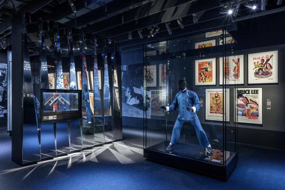 <p>A space all about Bruce Lee includes movie posters and costumes.</p>