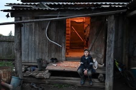 The Wider Image: Russian village's last teacher stays on for her one remaining pupil