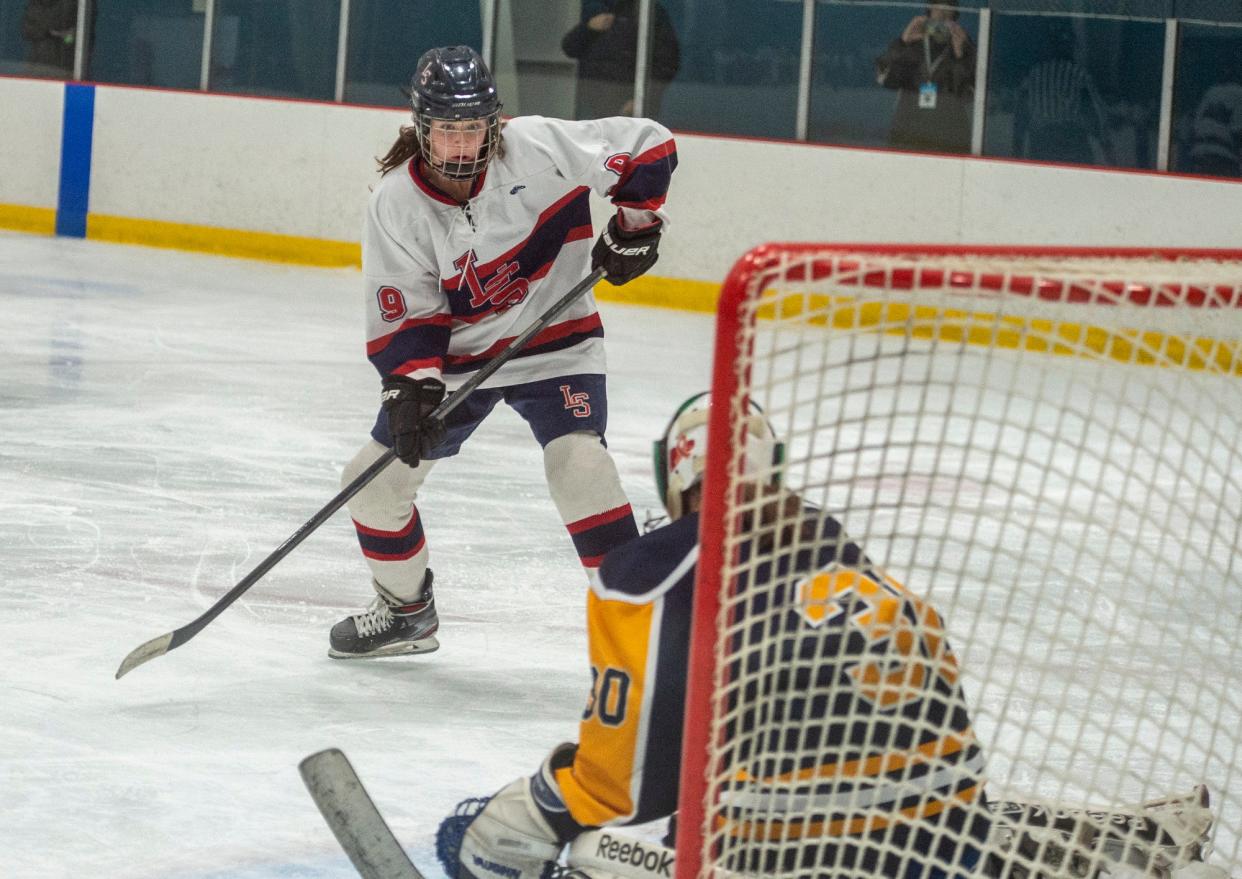 Lincoln-Sudbury Regional High School girls hockey player Ally Quinn looks for a loose puck against Andover, at Valley Sports Arena in Concord, Jan. 17, 2024.