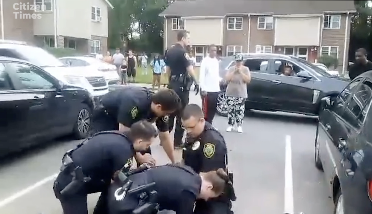 Residents of the Erskine-Walton neighborhood sounded alarmed and shouted for the three or more Asheville Police Department officers to stop as they struggled with Devon Whitmire on the ground during an arrest May 13.