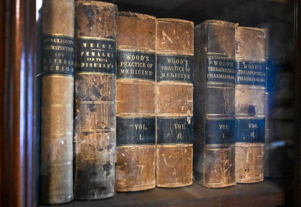 Medical books that had belonged to Dr. Thomas Meux sit on a bookshelf at the Meux home in downtown Fresno.