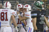 SMU placekicker Chris Naggar (34) celebrates with quarterback / holder Derek Green (12) after kicking the winning field goal in overtime to give his team a victory over Tulane in an NCAA college football game in New Orleans, Friday, Oct. 16, 2020. (AP Photo/Matthew Hinton)