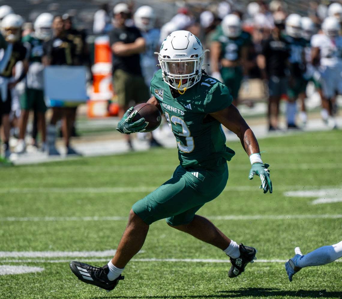 Sacramento State Hornets running back Zeke Burnett (13) cuts back during a run during the annual Sacramento State spring football game on Saturday at Sacramento State.