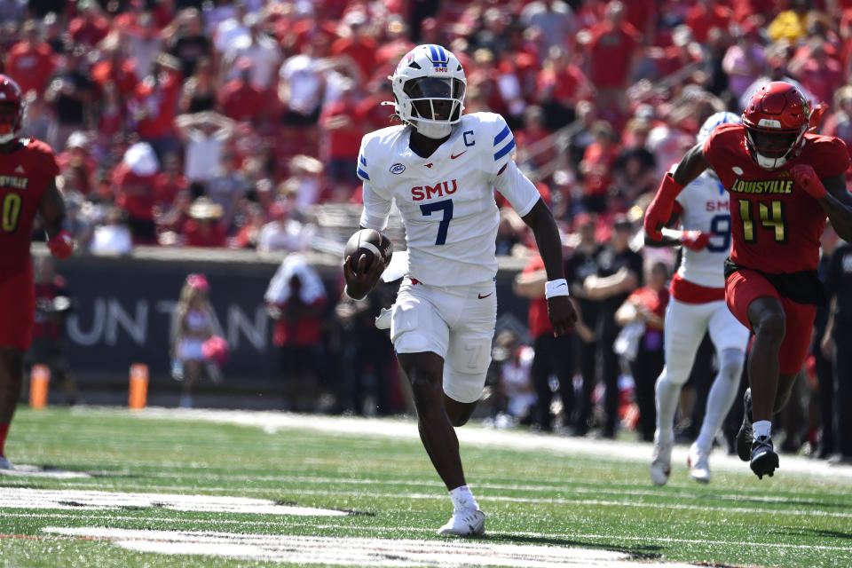 SMU quarterback Kevin Jennings (7) runs away from the Louisville defense to score a touchdown during the first half of an NCAA college football game in Louisville, Ky., Saturday, Oct. 5, 2024. (AP Photo/Timothy D. Easley)