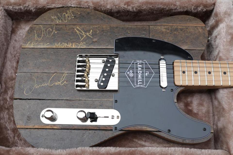 A guitar made from Leadmill floorboards, and signed by the Arctic Monkeys, raised £7,200.