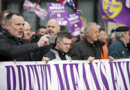 Tommy Robinson, front center, attends the "Brexit Betrayal Rally", a pro-Brexit rally, on Park Lane in London, Sunday, Dec, 9, 2018. MP's are to vote on the EU withdrawal agreement on Tuesday. (AP Photo/Tim Ireland)