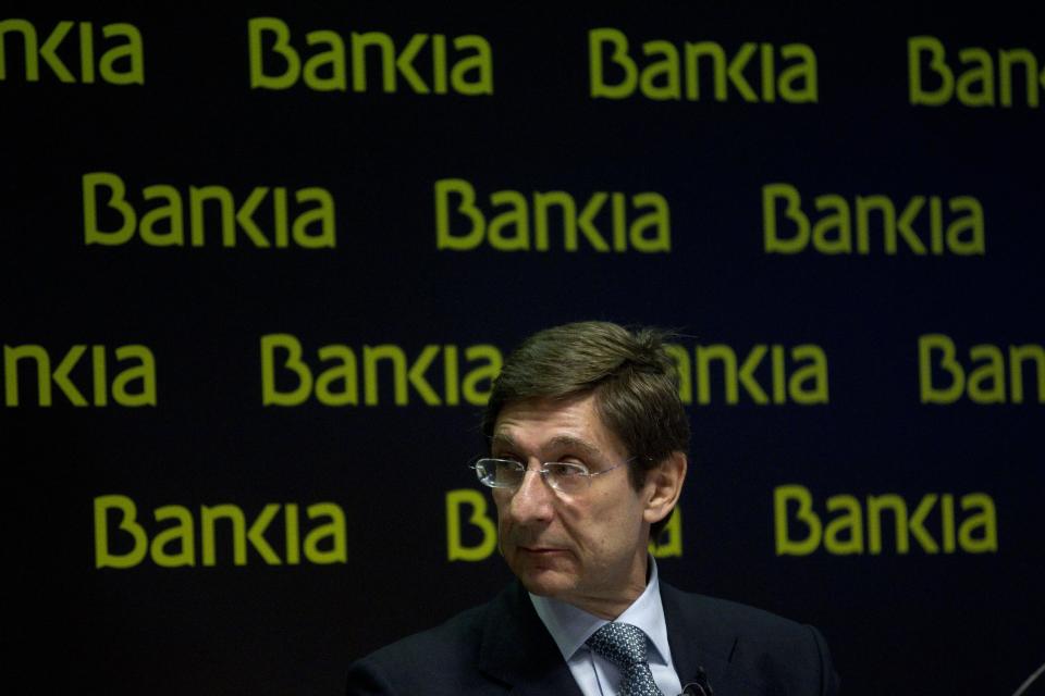 Bankia's president, Jose Ignacio Goirigolzarri, looks to his side during a press conference at the bank's headquarters , in Madrid, Saturday, May 26, 2012. Spain's troubled bank, Bankia, has asked the Spanish government for 19 billion euro ($23.8 billion) in financial support just as a leading credit rating agency downgraded it to junk status. The request came as Standard & Poor's downgraded Bankia and four other Spanish banks to junk status because of uncertainty over restructuring and recapitalization plans. (AP Photo/Antonio Heredia)
