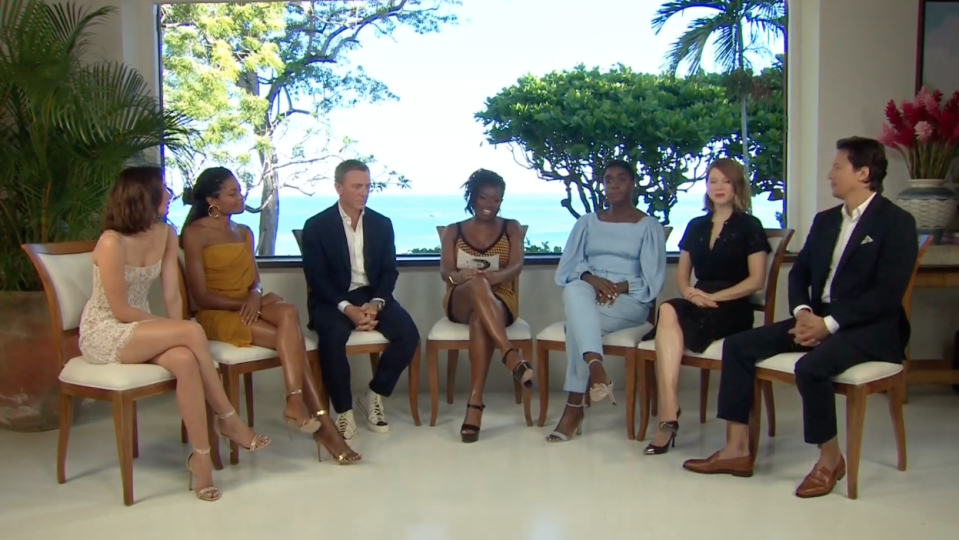 L-R Ana De Armas, Naomie Harris, Daniel Craig, host, Lashana Lynch, Lea Seydoux, and Cary Joji Fukunaga (YouTube)