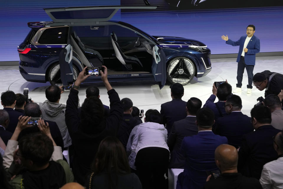 FILE - Jerry Gan, CEO of Geely Auto Group unveils the Galaxy Starship a new technology flagship AI-driven SUV prototype during Auto China 2024 in Beijing, Thursday, April 25, 2024. The European Union threatened on Wednesday, june 12, 2024, to hike tariffs on Chinese electric vehicles, escalating a trade dispute over Beijing's subsidies for the exports that Brussels worries is hurting domestic automakers. (AP Photo/Ng Han Guan, File)