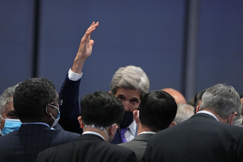 John Kerry, United States Special Presidential Envoy for Climate gestures at the end of a stocktaking plenary session at the COP26 U.N. Climate Summit in Glasgow, Scotland, Saturday, Nov. 13, 2021. Going into overtime, negotiators at U.N. climate talks in Glasgow are still trying to find common ground on phasing out coal, when nations need to update their emission-cutting pledges and, especially, on money. (AP Photo/Alastair Grant)