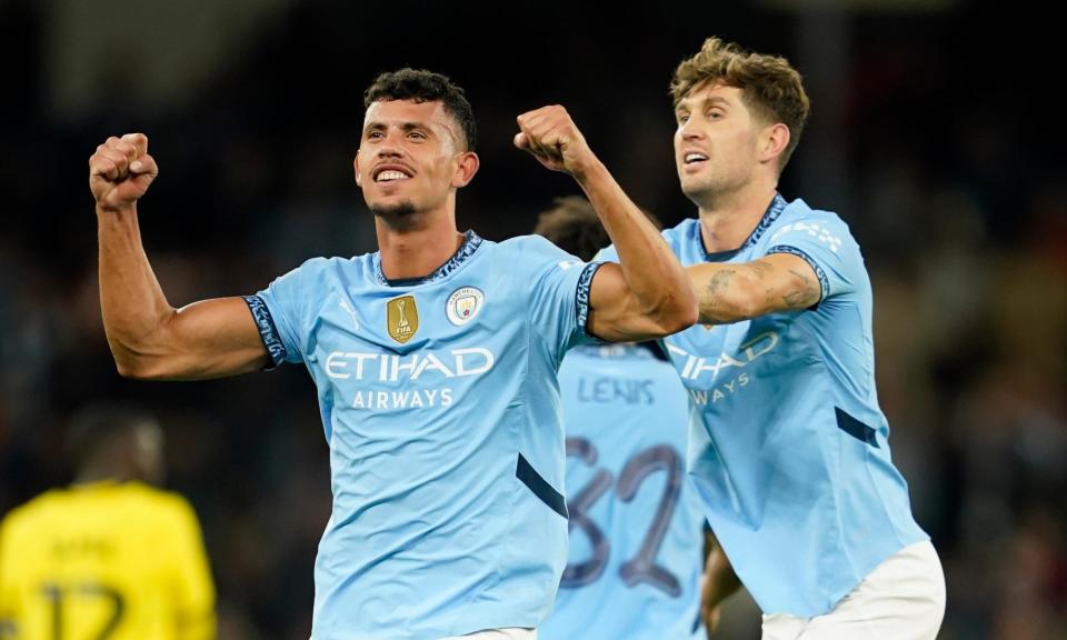 <span>Matheus Nunes celebrates his winner, his first goal for Manchester City, with teammate John Stones.</span><span>Photograph: Dave Thompson/AP</span>