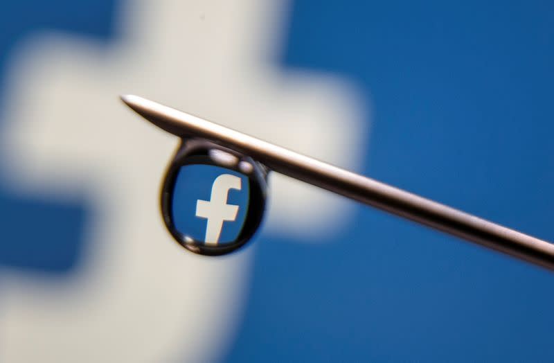 FILE PHOTO: Facebook logo is reflected in a drop on a syringe needle in this illustration photo