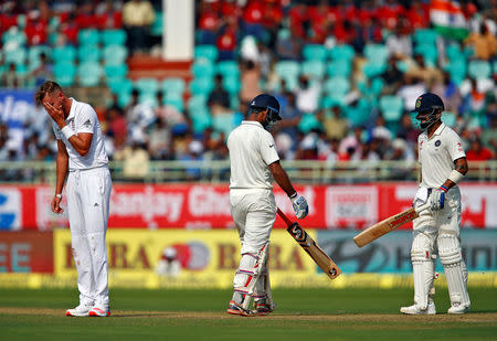 Cricket - India v England - Second Test cricket match - Dr. Y.S. Rajasekhara Reddy ACA-VDCA Cricket Stadium, Visakhapatnam, India - 17/11/16 - England's Stuart Broad reacts as India's Cheteshwar Pujara and Virat Kohli run between wickets. REUTERS/Danish Siddiqui