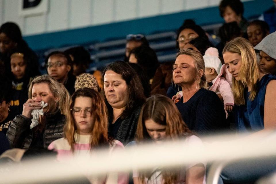 Family, friends and community members attend a candlelight vigil in honor of three Gautier High School graduates at Gautier High School in Gautier on Thursday, Dec. 7, 2023. Se’Dhari Saniya Watson-Person, Kyla “Muffin” Watkins, and Tatyanna Richmond were involved in a fatal crash on Tuesday, leading to the deaths of Watson-Person and Watkins. Richmond remains hospitalized.