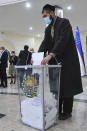 A man casts his ballot at a polling station during the presidential election in Tashkent, Uzbekistan, Sunday, Oct. 24, 2021. Uzbeks voted Sunday in a presidential election that the incumbent is expected to win in a landslide against weak competition. Although Shavkat Mirziyoyev has relaxed many of the policies of his dictatorial predecessor, he has made little effort at political reform. He took office in 2016 upon the death of Islam Karimov and faces four relatively low-visibility candidates who did not even show up for televised debates. (AP Photo)