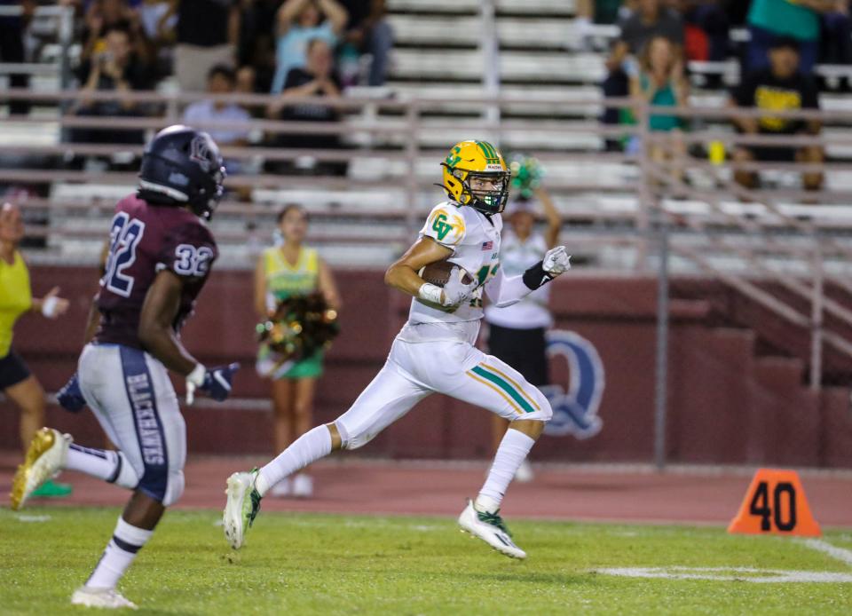 Coachella Valley's Keon Lenoir (13) runs the ball during the second quarter of their game at La Quinta High School in La Quinta, Calif., Friday, Sept. 2, 2022. 