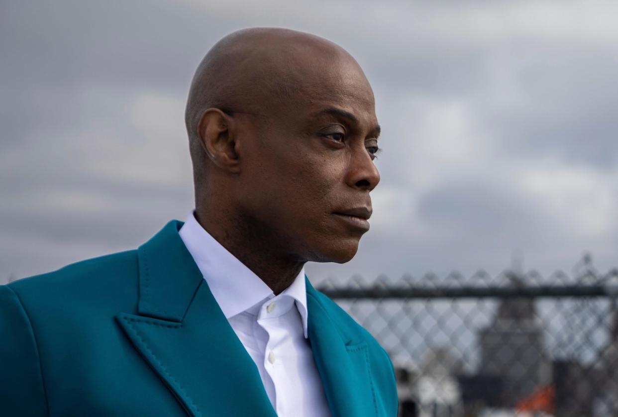 Detroit R&B star Kem stands at the riverfront as he gazes toward Canada near the Ambassador Bridge in Detroit on Tuesday, March 14, 2023.