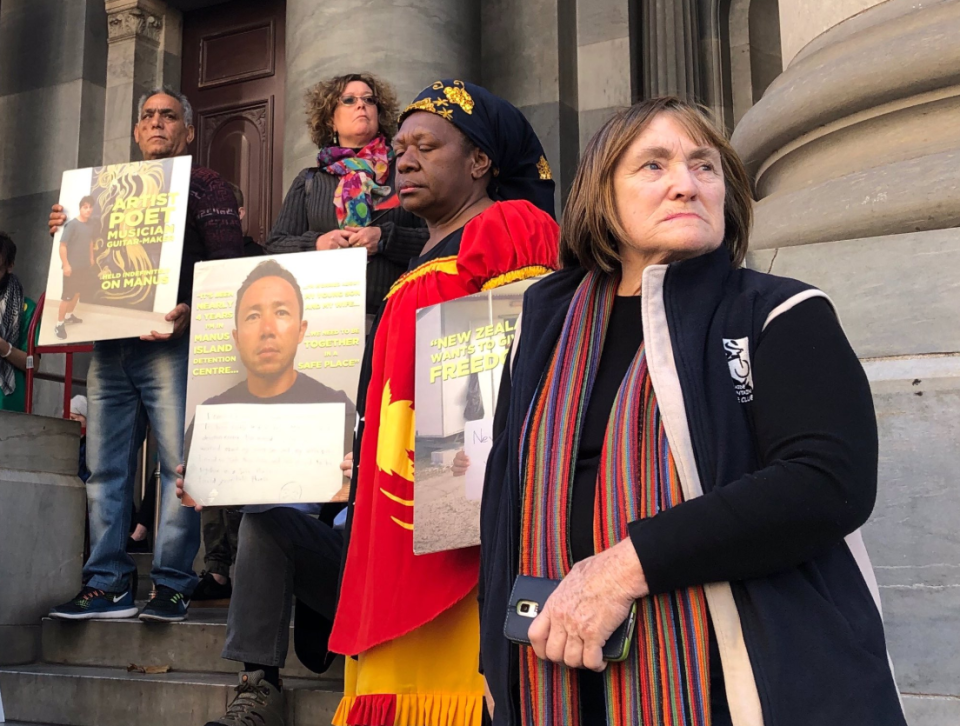 Protestors hold up signs in Adelaide in condemnation of the Australian government's offshore detention centres. 