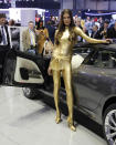 A model poses for the unveiling of the Bertone Jet 2+2 at the 2013 Geneva Motor Show.