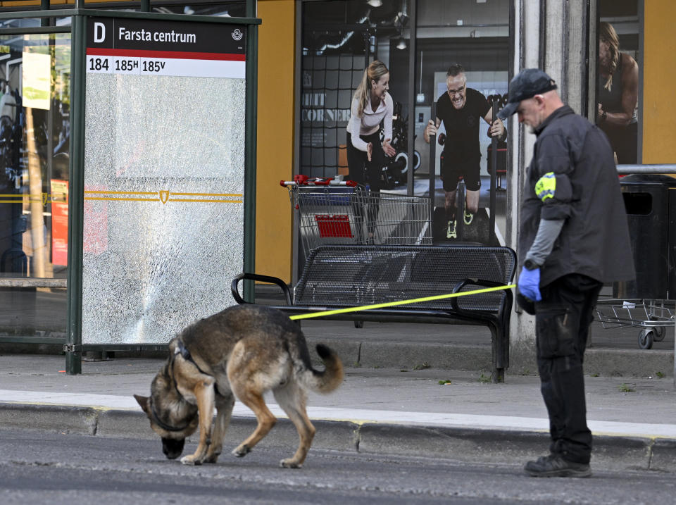 FILE - Police at the scene after a shooting incident, in Farsta, southern Stockholm, Saturday, June 10, 2023. A 13-year-old boy from the suburbs of Stockholm who was found dead in the woods near his home earlier this month, was the latest victim of a deadly gang war in Sweden where the group, warring over arms and drug trafficking, reportedly are recruiting children. (Anders Wiklund /TT News Agency via AP, File)