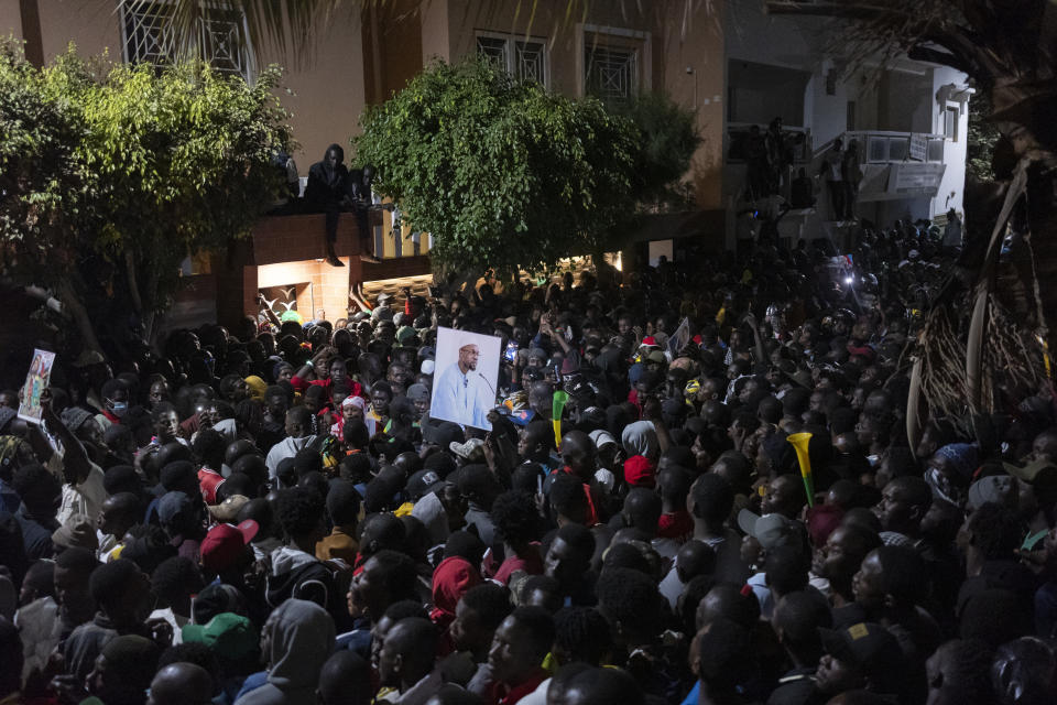 Supporters celebrate the release of Senegal's top opposition leader Ousmane Sonko and his key ally Bassirou Diomaye Faye outside Sonko's home in Dakar, Senegal, Thursday, March 14, 2024. Sonko had been in prison since July 2023 and has fought a prolonged legal battle to run for president in the March 24 election.(AP Photo/Sylvain Cherkaoui)