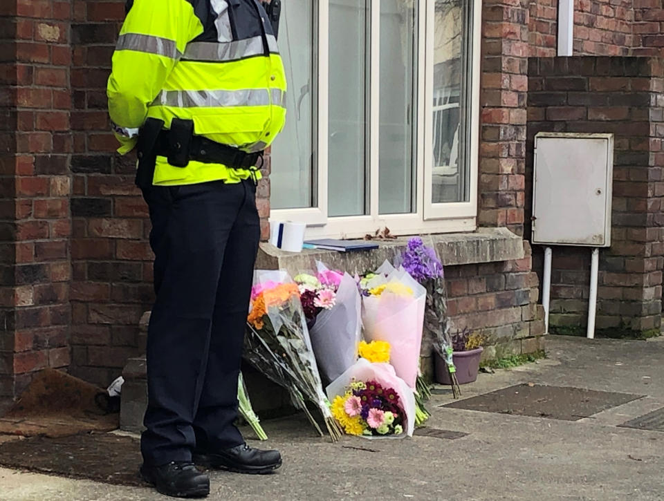 Flowers outside a house in the village of Newcastle, south west of Dublin city where three children were found dead on Friday (Picture: PA0