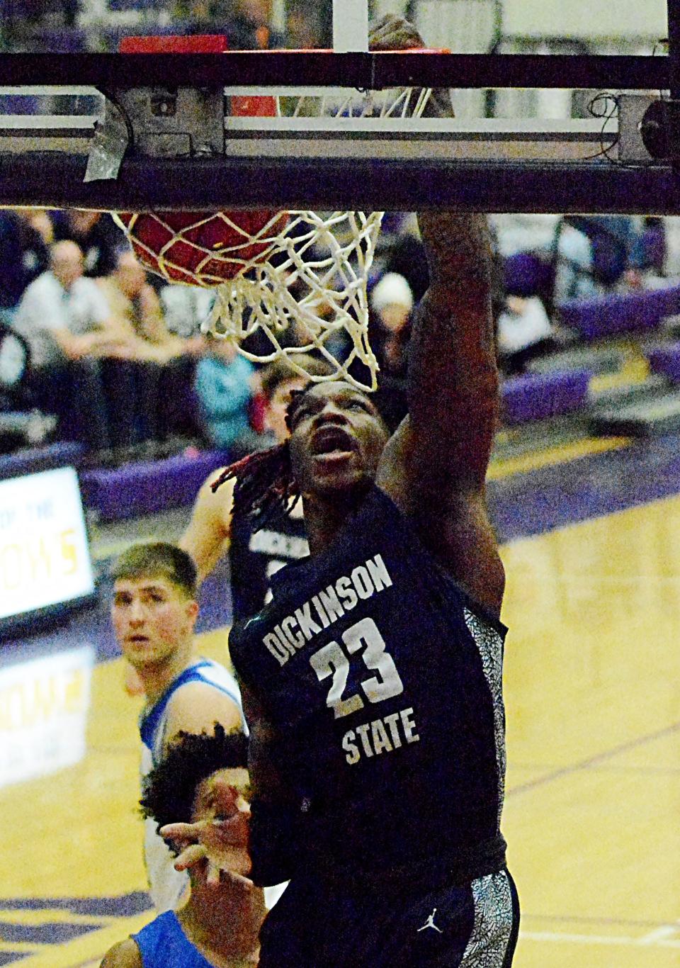 Dickinson State's Christian Murphy dunks the ball during the men's championship game of the North Star Athletic Association Basketball Final Four on Sunday, Feb. 26, 2023 in the Watertown Civic Arena.