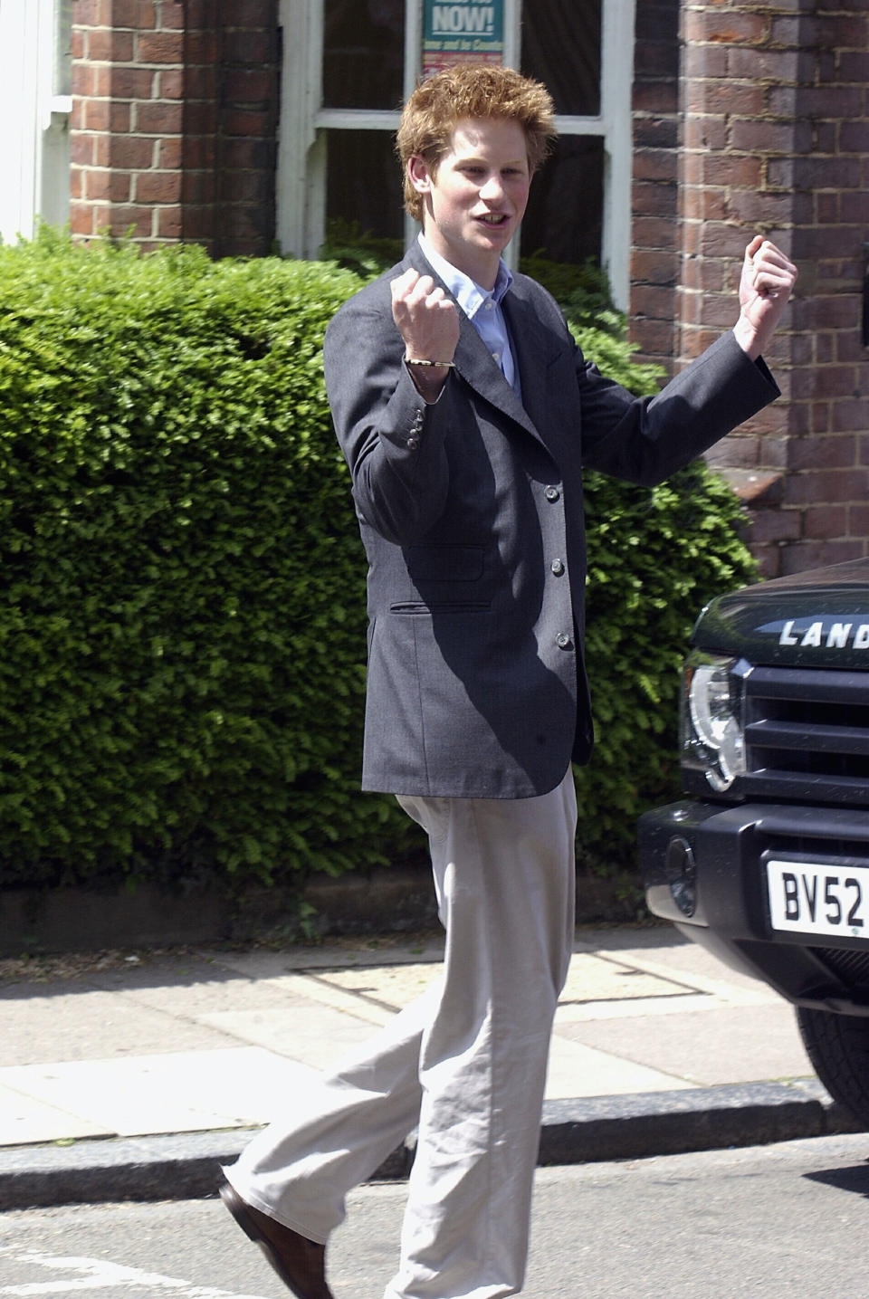 Prince Harry clenches his fist as he leaves Eton College on June 12, 2003.