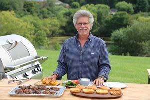 On the set of Steven Raichlen's Project Fire, Steven is shown with grilled softshell Chesapeake blue crab sandwiches.