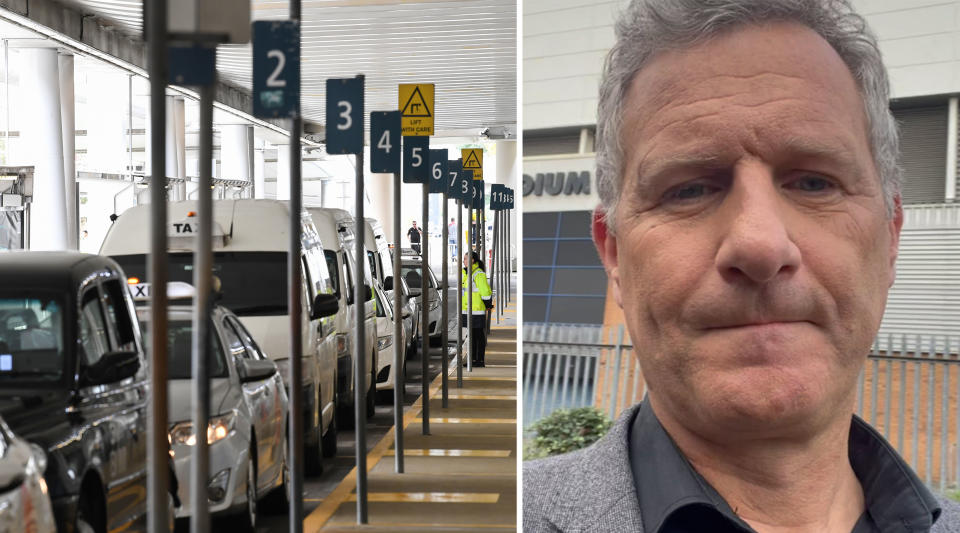 Adam Hills next to a taxi rank at Sydney Airport.