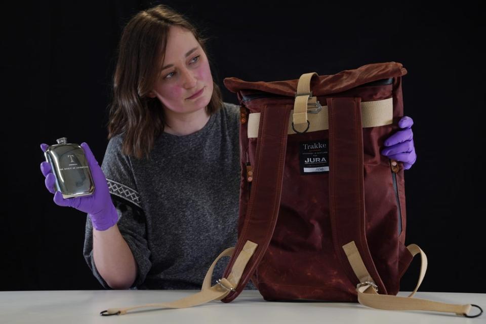 Doctoral Researcher Laura Scobie, with items acquired by National Museums Scotland (National Museums Scotland)