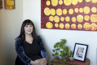 In this photo provided by the John D. and Catherine T. MacArthur Foundation, Monica Muñoz Martinez sits for a portrait at the University of Texas in Austin on Sept. 16, 2021. The historian devoted to keeping alive stories of long-dead victims of racial violence along the Texas-Mexico border is among this year's MacArthur fellows and recipients of "genius grants." (John D. and Catherine T. MacArthur Foundation via AP)