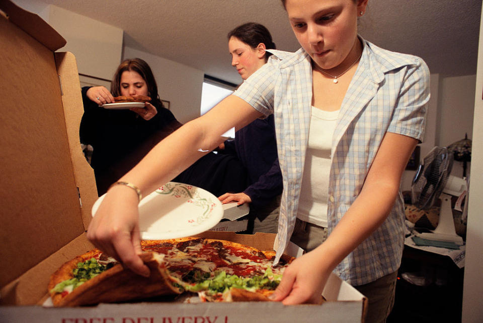 Young people with a pizza pie