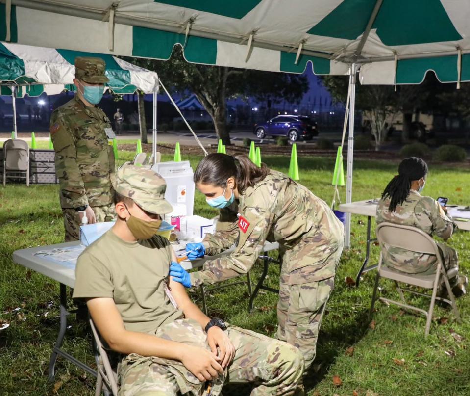 A soldier receives a COVID-19 vaccine during a mass vaccination clinic at Eisenhower Medical Center on Friday morning, Oct. 1, 2021.