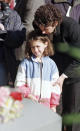 Michelle Haimowitz, 8, is comforted by her mother, Arlene Fisk, a Philadelphia Assistant District Attorney in the Homicide office, as she looks at the coffin, in foreground, holding "America's Unknown Child" after graveside services at Ivy Hill Cemetary on Wednesday, Nov. 11th, 1998 in Philadelphia. The body of the unidentified boy was found almost 40 years ago in a box. (AP Photo/William Thomas Cain)