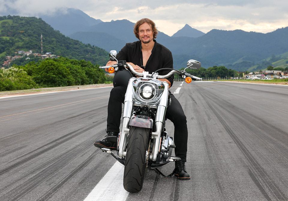 Survivor winner David Genat on a motorcyle.