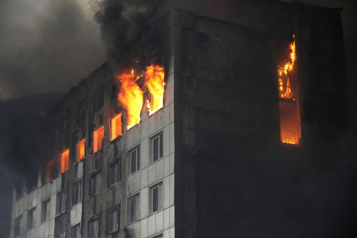 A building is engulfed in flames after shelling in Kyiv, Ukraine, Thursday, March 3, 2022.