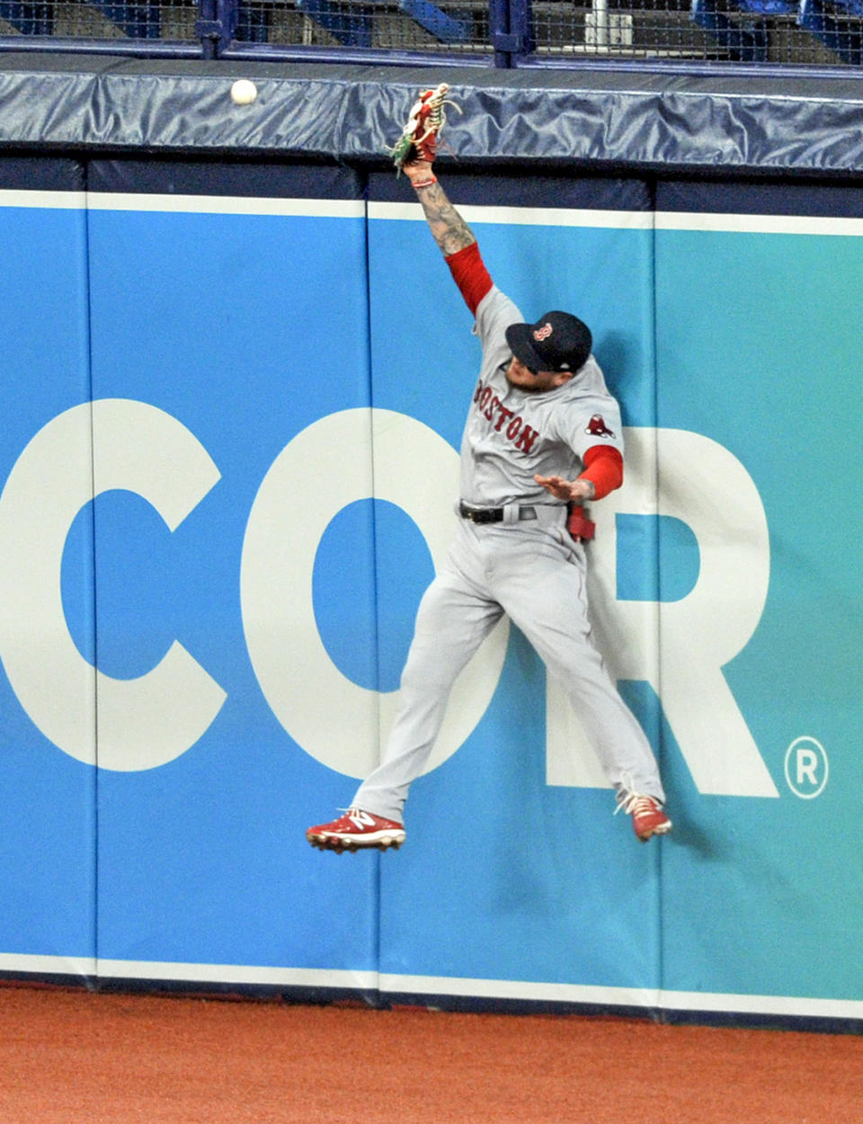 Boston Red Sox right fielder Alex Verdugo comes up short as he leaps for a double off the wall hit by Tampa Bay Rays' Yandy Diaz during the first inning of a baseball game Wednesday, Aug. 5, 2020, in St. Petersburg, Fla. (AP Photo/Steve Nesius)