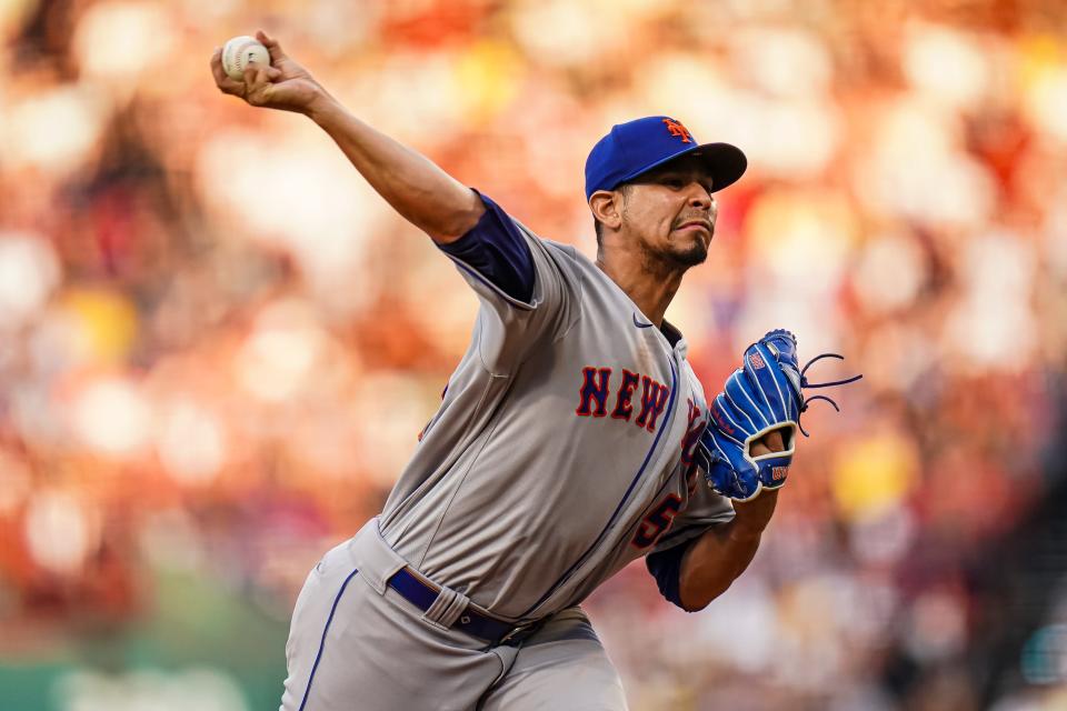 New York Mets starting pitcher Carlos Carrasco (59) throws a pitch against the Boston Red Sox in the first inning on July 23, 2023, at Fenway Park.