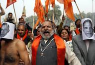 Supporters of Rashtrawadi Shiv Sena, a Hindu hardline group, shout anti-U.S. slogans during a protest near the U.S. embassy in New Delhi December 18, 2013. Indian police removed concrete security barriers outside the U.S. Embassy in New Delhi on Tuesday in apparent retaliation for the treatment of an Indian diplomat who was strip-searched after her arrest in New York last week. The diplomatic spat was triggered by the December 12 arrest of Devyani Khobragade, a deputy consul general at the Indian Consulate in New York, on charges of visa fraud and making false statements for allegedly lying about how much she paid her housekeeper, an Indian national.(REUTERS/Ahmad Masood)