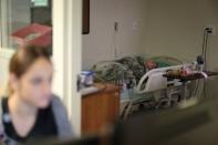 Inmate Joseph Morrow, 69, who has bladder cancer, lies in bed at the California Medical Facility prison in Vacaville, California, U.S., May 22, 2018. REUTERS/Lucy Nicholson