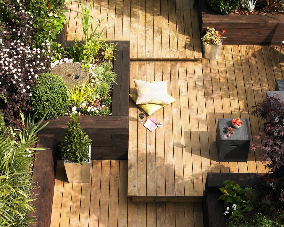 6. Surround a deck with raised beds made from sleepers