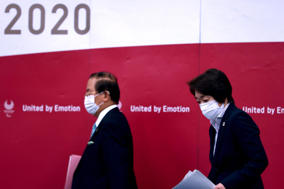 Tokyo 2020 president Seiko Hashimoto, right, and CEO Toshiro Muto attend a press conference, in Tokyo, Thursday, July 8, 2021. (Behrouz Mehri/Pool Photo via AP)