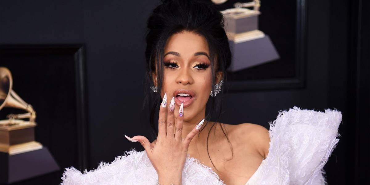 Cardi B flaunts midriff in red bra as she leads performances at