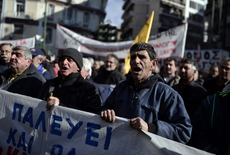 Greek farmers chant slogans as they protest in central Athens on February 14, 2017